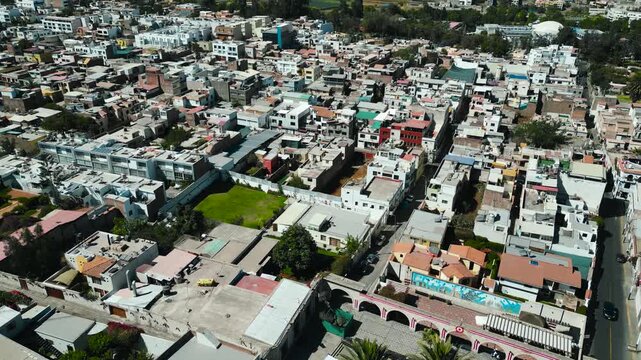 Smooth drone tracking shot over the white city of Arequipa with a breathtaking view of Misti volcano, Peru.