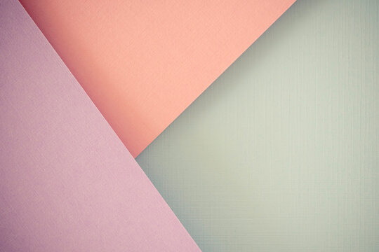 Geometric arrangement of colored paper in pink, lavender, and mint green. Pastel colors create soft, modern background