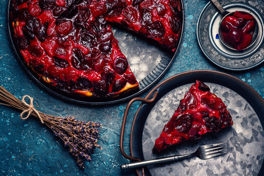 Freshly baked homemade cherry pie slice served on rustic metal tray