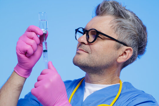 Healthcare Professional Preparing Vaccine with Syringe in Laboratory Setting