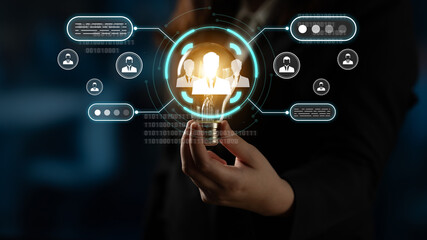 Fototapeta premium Business Professional Holding Futuristic Interface Displaying Digital Icons and Binary Code Concept of Technology, Networking, and Communication in a Corporate Environment. Sentient.