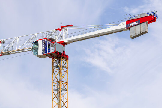 Nancy, France - July 11th 2026 : View on a flat-top tower crane Potain MDT 178 H8 on a construction site for the construction of a building.