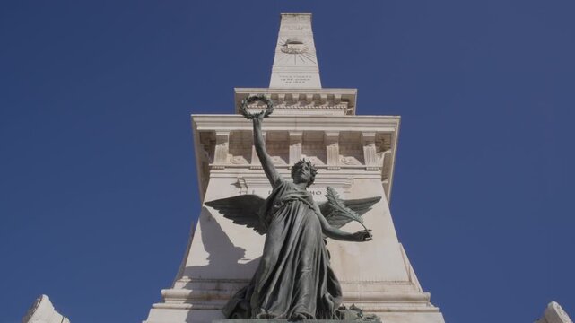 Restauradores Monument Against Blue Sky in Lisbon Portugal Summer Golden Hour Shot with Cinema Camera