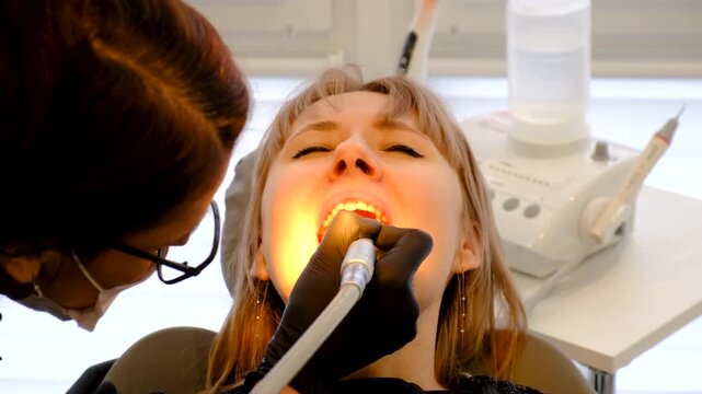 Woman at the dentist office. Selective focus. copy space.