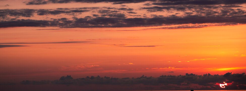Beautiful summer sunset sky colorful clouds.