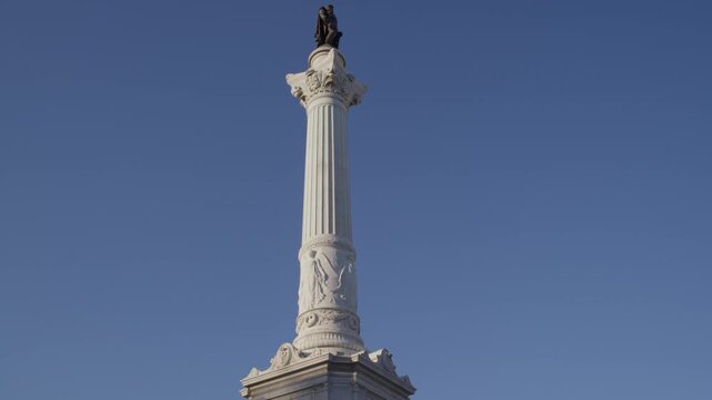 Close View of Restauradores Monument Obelisk in Lisbon Portugal During Summer Golden Hour Shot with Cinema Camera