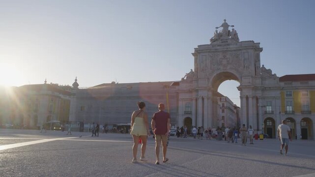People Walking Near Rua Augusta Arch in Lisbon Portugal During Summer Golden Hour Shot with Cinema Camera