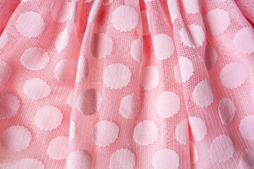 Pink polka dot mesh fabric draped texture © Iryna Miadzvedzeva