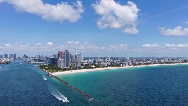 Miami skyscrapers above the coastline. Aerial view of Miami beach and ocean.