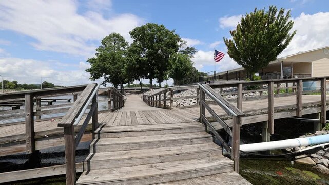Wooden Boardwalk with Trees and American Flag in Scottsboro, Alabama