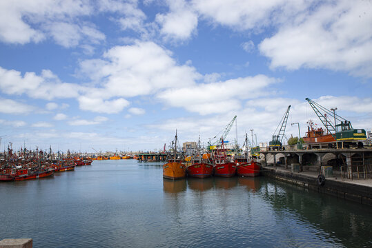 Mar del Plata , Buenos Aires province , Argentina; 12-20-2018: Fishing fleet docks at harbor with red and orange trawers