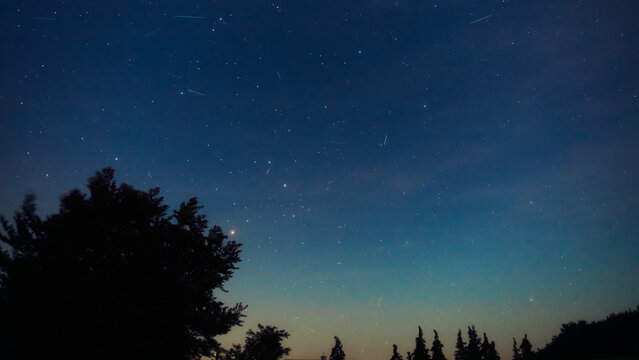 Summer Milky Way stars and landscape scenery silhouettes.