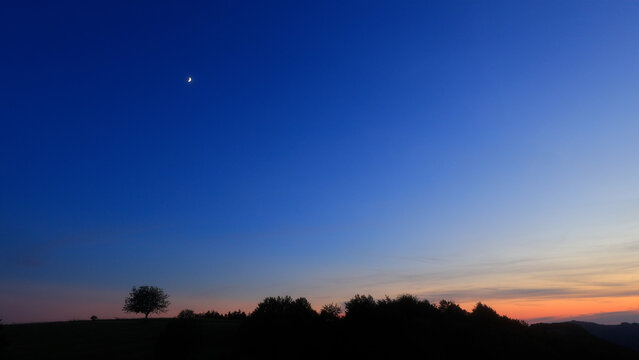 Moon, planet conjunction and landscape scenery silhouettes.