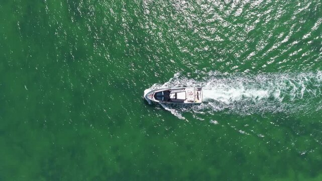 Luxury lifestyle. Vacation on summer. Yacht at sea. Motorboat yacht sailing at sea. Motorboat aerial top view. Luxury boat motor yacht at sea. Yachting boat tourism. Marine escape