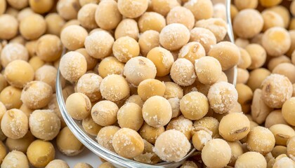 Fototapeta premium Close-up view of dried chickpeas in a wooden bowl.