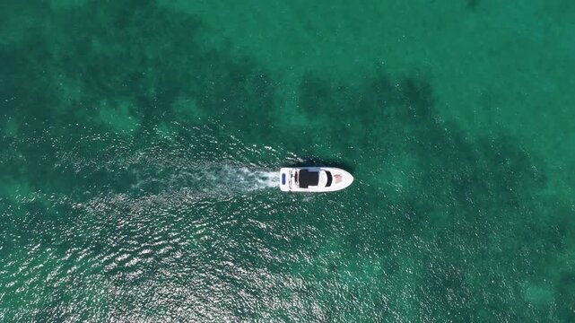 Yacht starts its sea trip. Seascape view of luxury yacht in sea. Luxury yacht 4k footage. Summer vacation. Motor yacht boat in sea. Boat trip. Travel destination. Boat in the sea