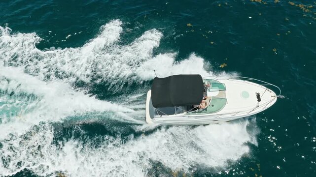 Motor yacht boat in sea. Boat trip. Travel destination. Boat in the sea. Small boat. Yacht starts its sea trip. Seascape view of luxury yacht in sea. Luxury yacht 4k footage. Summer vacation