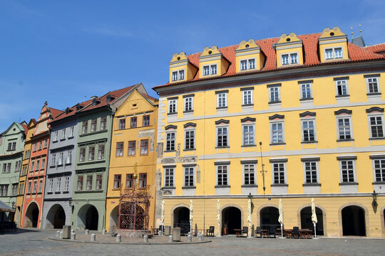 Colorful row of historic european townhouses on empty square in Prague for cityscape background and travel poster design. Old Town Square of Prague