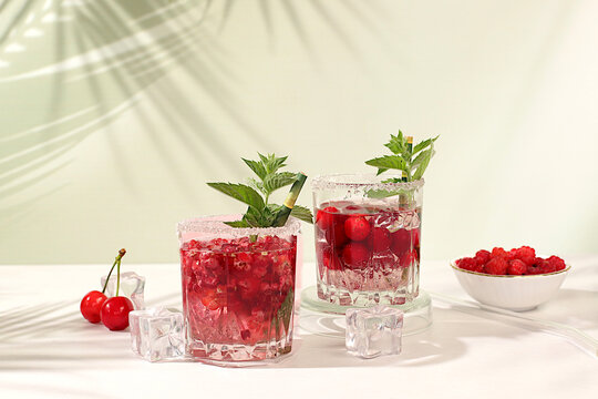 Mojito with sprite, mint and fresh berries,Detox water with raspberries, cherries, and currants, over ice. A refreshing summer homemade lemonade cocktail. Fruit juice and ingredients,