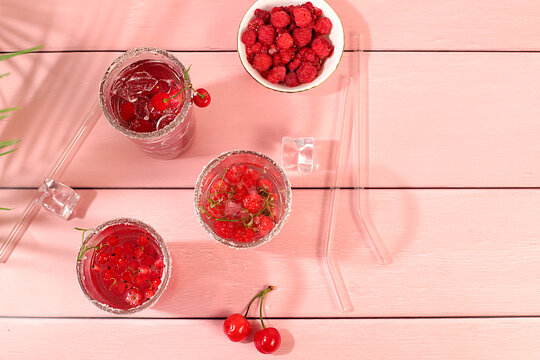 Dietary vegan water with raspberries, currants, and cherries, detox water, mojito with Sprite, mint, and fresh berries. Detox diet and weight loss concept, healthy lifestyle advertising,