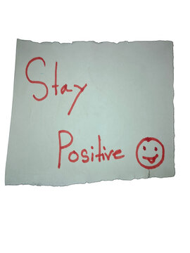 Stay positive handwritten note with a happy smiley face