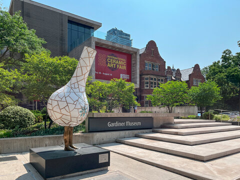 Gardiner Museum entrance with large white ceramic Cracked Wheat sculpture by Shary Boyle and red International Ceramic Art Fair banner, Toronto July 2026