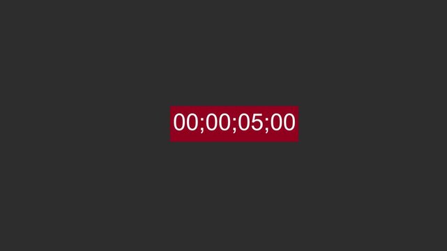 Digital red timecode counting on a black background