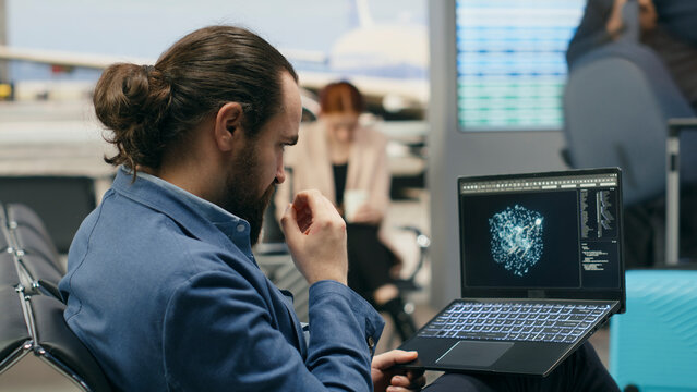 Stressed businessman using AI deep learning systems on laptop in airport lounge, tense work trip for multinational company, with a professional working with machine learning algorithms.
