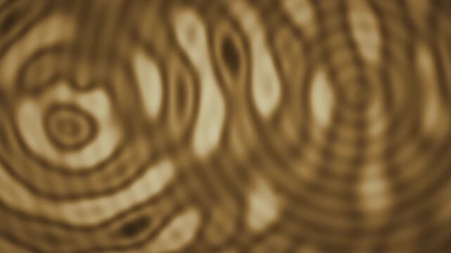 Abstract wave interference moire fringe ripple background seamless loop in soft amber tones