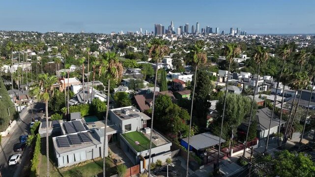 Los Angeles, California, USA - June 18, 2026: Palm trees of the Silver Lake neighborhood frame the downtown LA skyline.