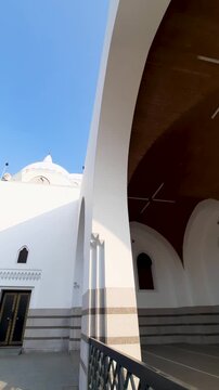 Beautiful arched ceilings and white dome of historic Masjid al Jummah in Medina Saudi Arabia.