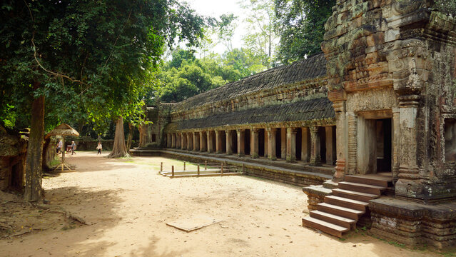 Ancient stone gallery corridor with columns at a historic temple