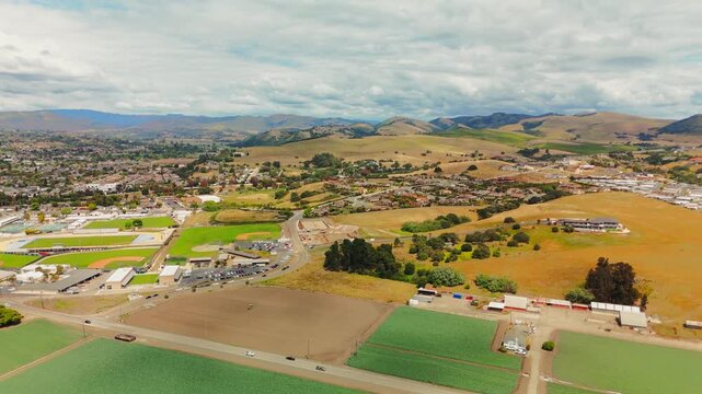 Elevated aerial panorama over Arroyo Grande showing sports fields and community