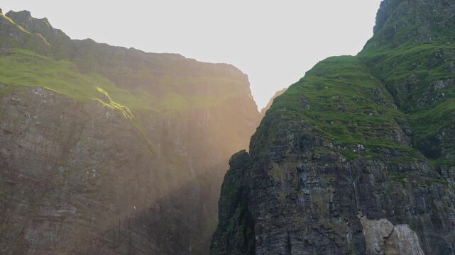 Dramatic Canyon Cliffs With Lush Greenery on Faroe Islands