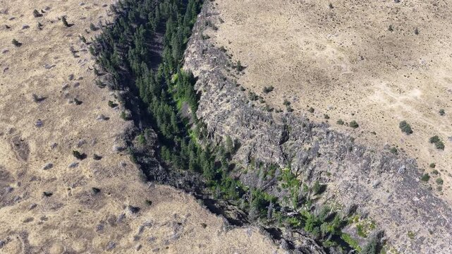 Over millennia Mill Creek has carved a 230-foot deep canyon on the Central Oregon plateau between Bend and Portland. This rugged yet scenic area of high desert is part of the Warm Springs reservation.