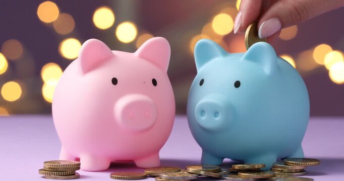 Woman putting coins into piggy bank and shaking it against purple background with blurred lights, closeup. Bokeh effect