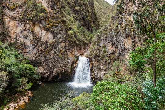 Beautiful landscape of Cascadas El Rodeo (El Rodeo Waterfalls) surrounded by lush green mountains in Ecuador, Azuay Province, San Felipe River