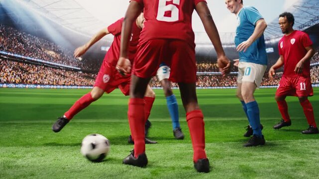 Lower body soccer players in red and blue uniforms dribbling each other for ball possession, running across pitch during match play, footballers in motion blur, for ball control and football attack.
