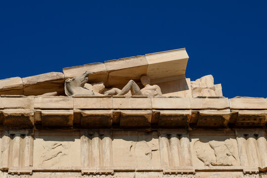 Close-up of sculptural details and Doric entablature on the Parthenon at the Acropolis in Athens, Greece.