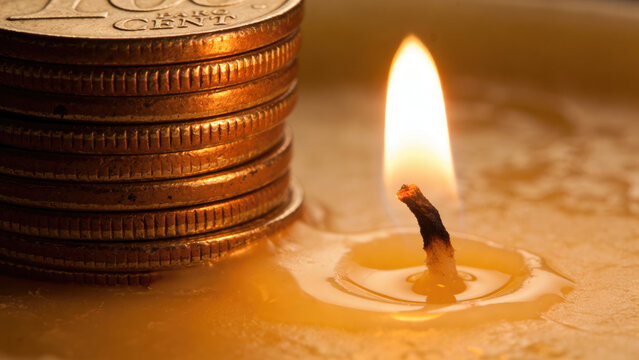 Stack of Coins Burning Money Concept, Candle Flame Melting Wax