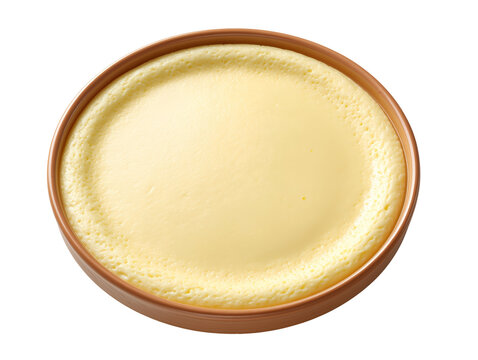 Creamy vanilla pudding served in a rustic ramekin, isolated on a white background with a smooth, silky custard texture.