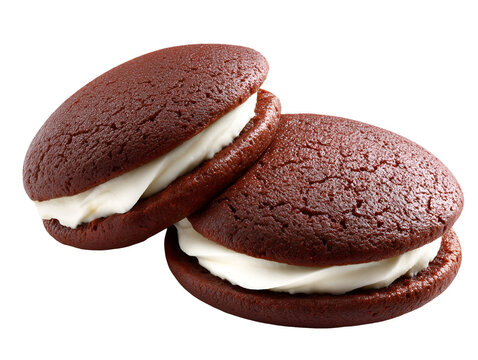 Chocolate whoopie pies filled with smooth vanilla cream, soft cake-like cookies, isolated on a white background.