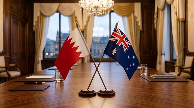 Small flags of Bahrain and Australia on a luxury conference table symbolizing diplomatic relations