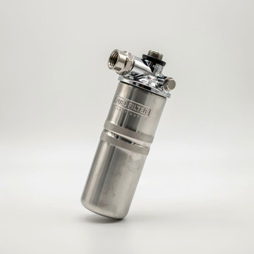 Stainless steel fuel filter with chrome fittings and text label on white background automotive engine