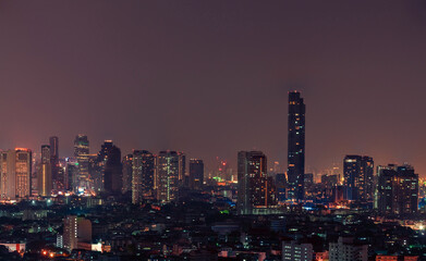 Obraz premium Cityscape of modern building in the night. Modern architecture office building. Skyscraper with beautiful evening sky. Business and financial center building. Apartment in the city with night light.
