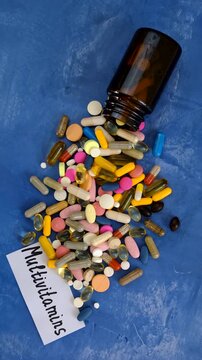 Various tablets and capsules, supplements and vitamins. Selective focus.