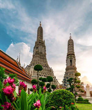 Wat Arun Ratchawararam Buddhist temple with blue sky in Bangkok, Thailand. Ancient architecture, cultural heritage, and famous travel destination. historic Buddhist architecture, cultural tourism.