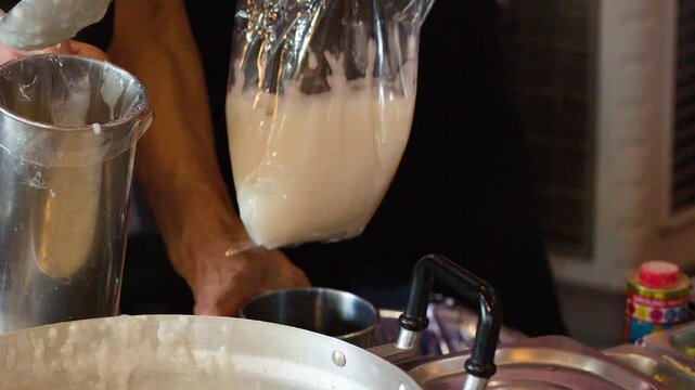 Asian Street Food Chef Serving Hot Rice Porridge Into Plastic Bag