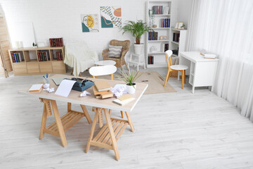 Interior of authors office with tables and bookshelves © Pixel-Shot