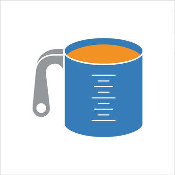 Blue measuring cup with liquid for cooking and baking in kitchen